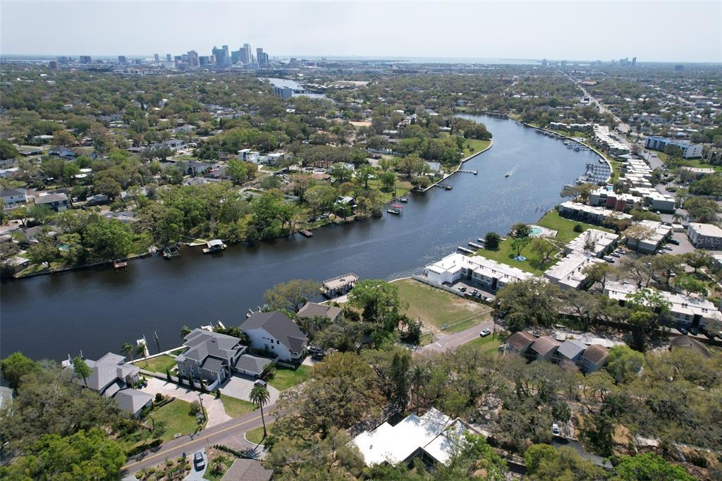 4033 North River View Avenue Tampa, FL 33607 - Photo 61 of 66 an aerial view of a house with a yard and lake view in back