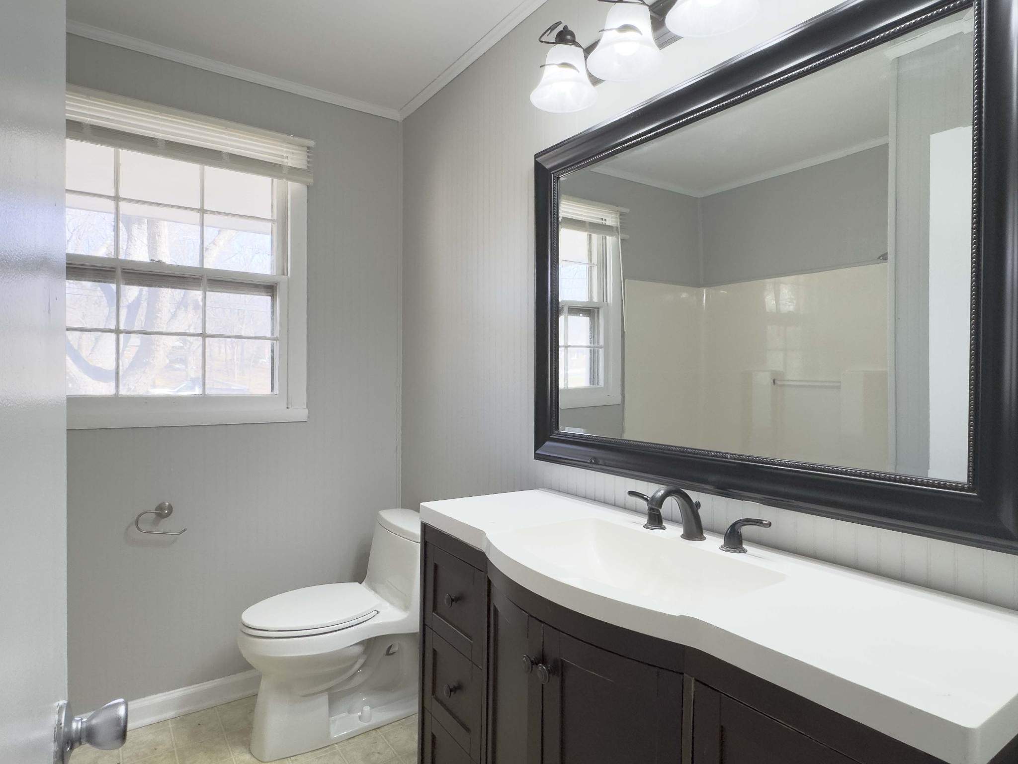 328 Dunbar Cave Road Clarksville, TN 37043 - Photo 13 of 26 a bathroom with a sink a toilet and mirror
