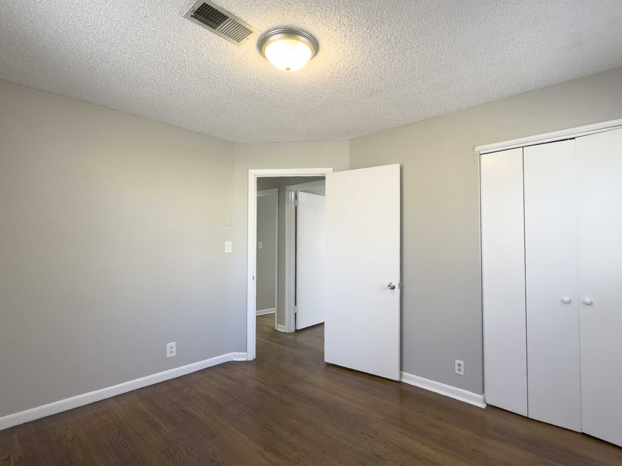 328 Dunbar Cave Road Clarksville, TN 37043 - Photo 20 of 26 an empty room with wooden floor and closet