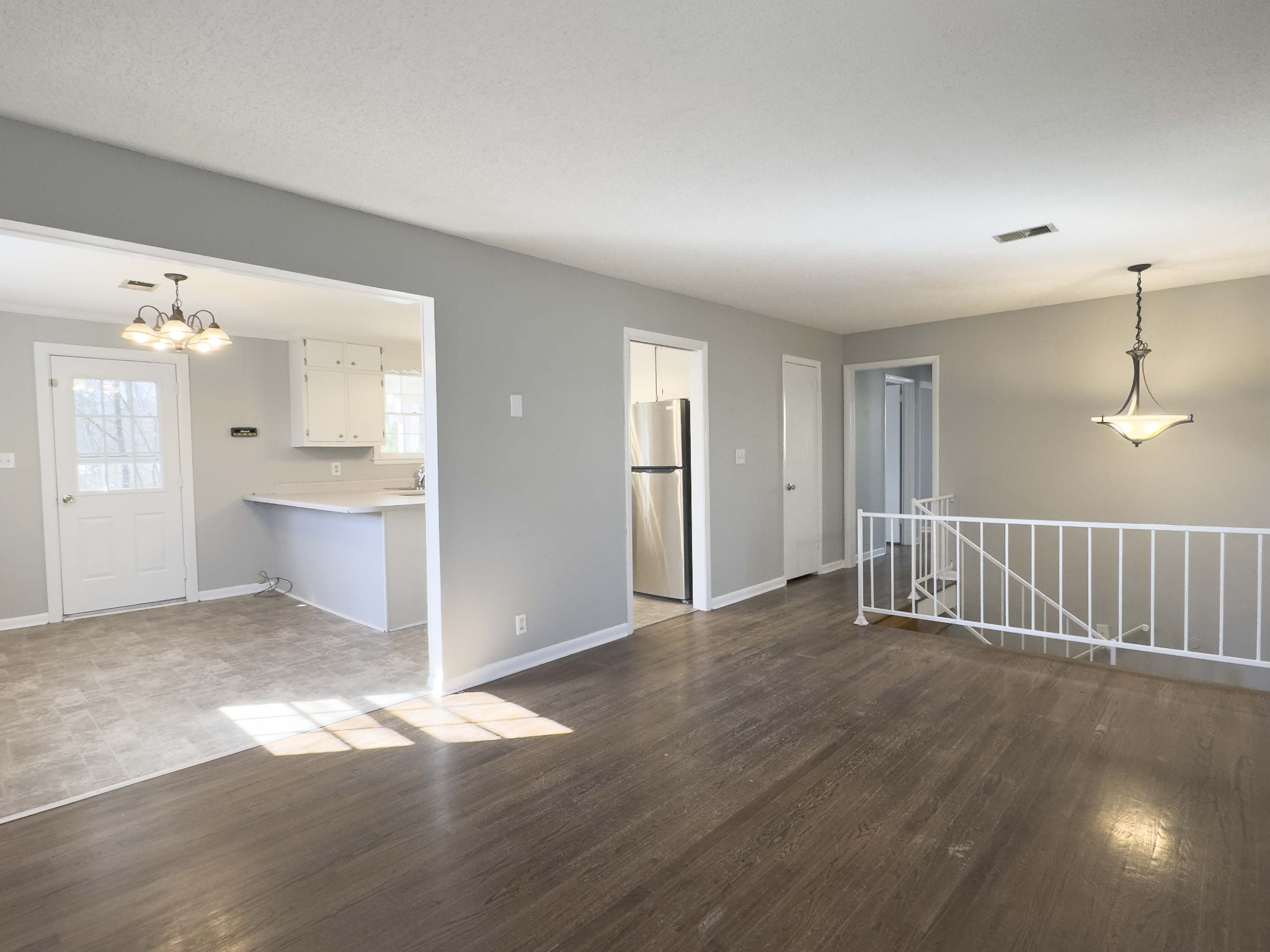 328 Dunbar Cave Road Clarksville, TN 37043 - Photo 3 of 26 an empty room with wooden floor and windows