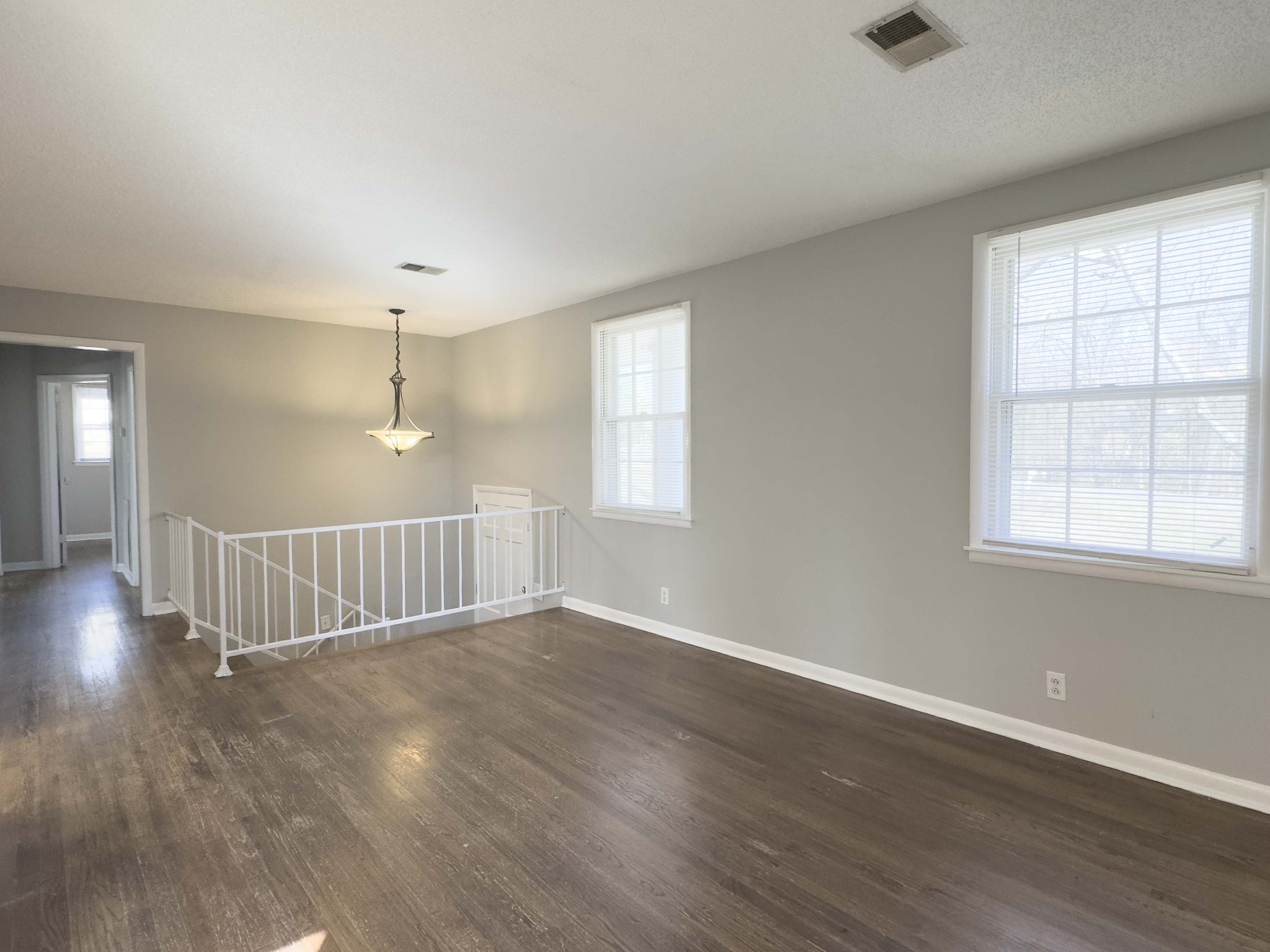 328 Dunbar Cave Road Clarksville, TN 37043 - Photo 4 of 26 an empty room with wooden floor and windows
