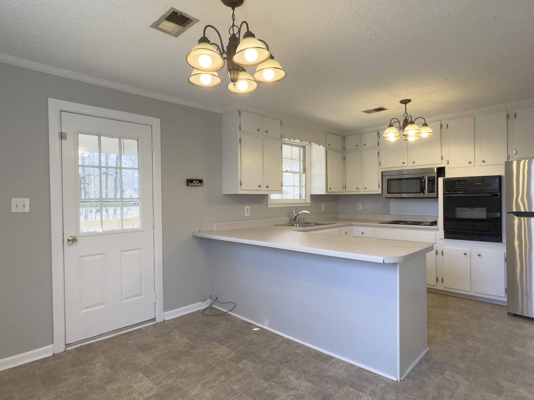 328 Dunbar Cave Road Clarksville, TN 37043 - Photo 10 of 26 a view of a kitchen with a sink and dishwasher kitchen view