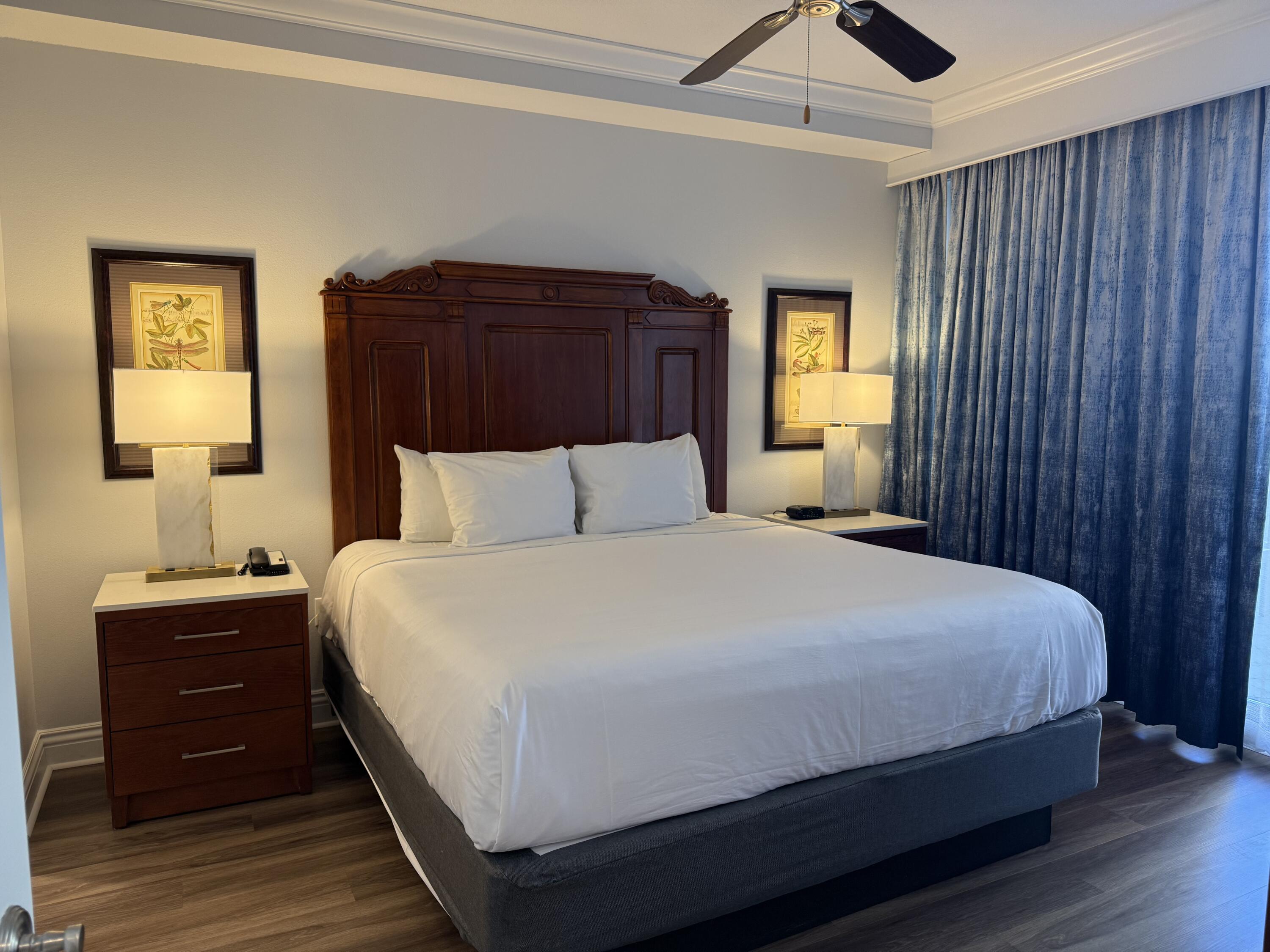 10 Harbor Boulevard, Unit E102F Destin, FL 32541 - Photo 11 of 29 a bedroom with a bed and a window