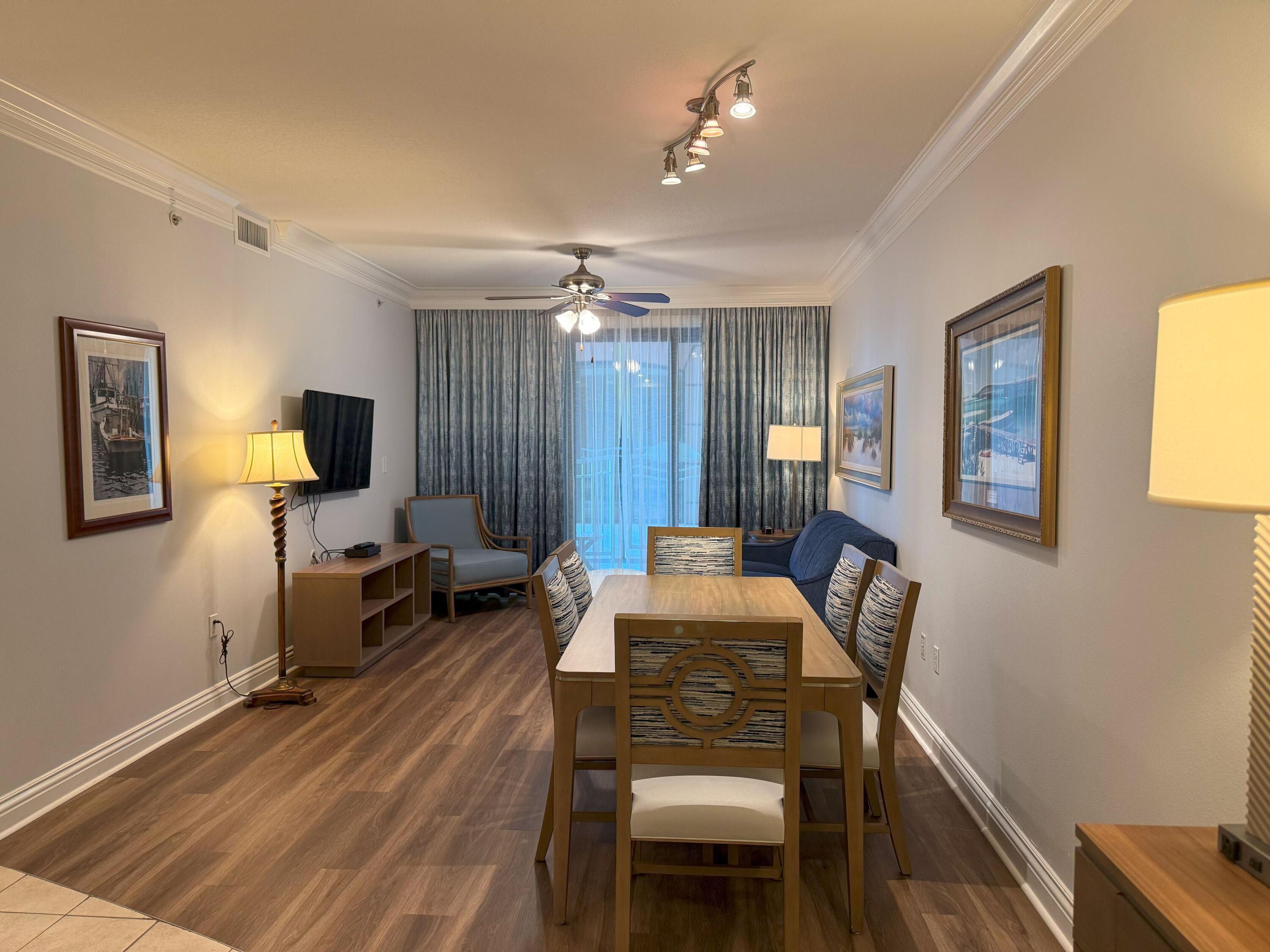 10 Harbor Boulevard, Unit E102F Destin, FL 32541 - Photo 2 of 29 a living room with furniture and a flat screen tv