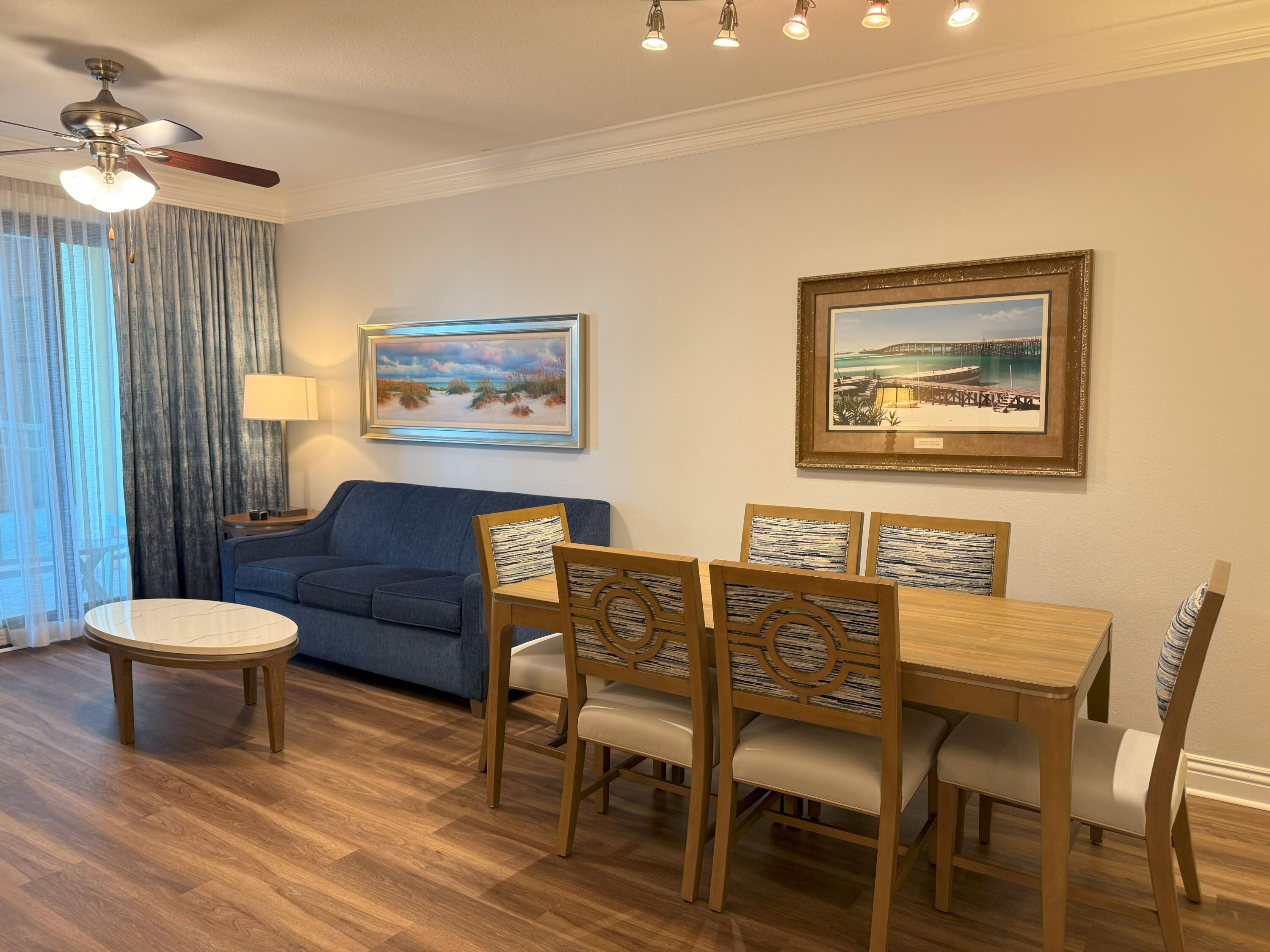 10 Harbor Boulevard, Unit E102F Destin, FL 32541 - Photo 3 of 29 a view of a dining room with furniture and a chandelier