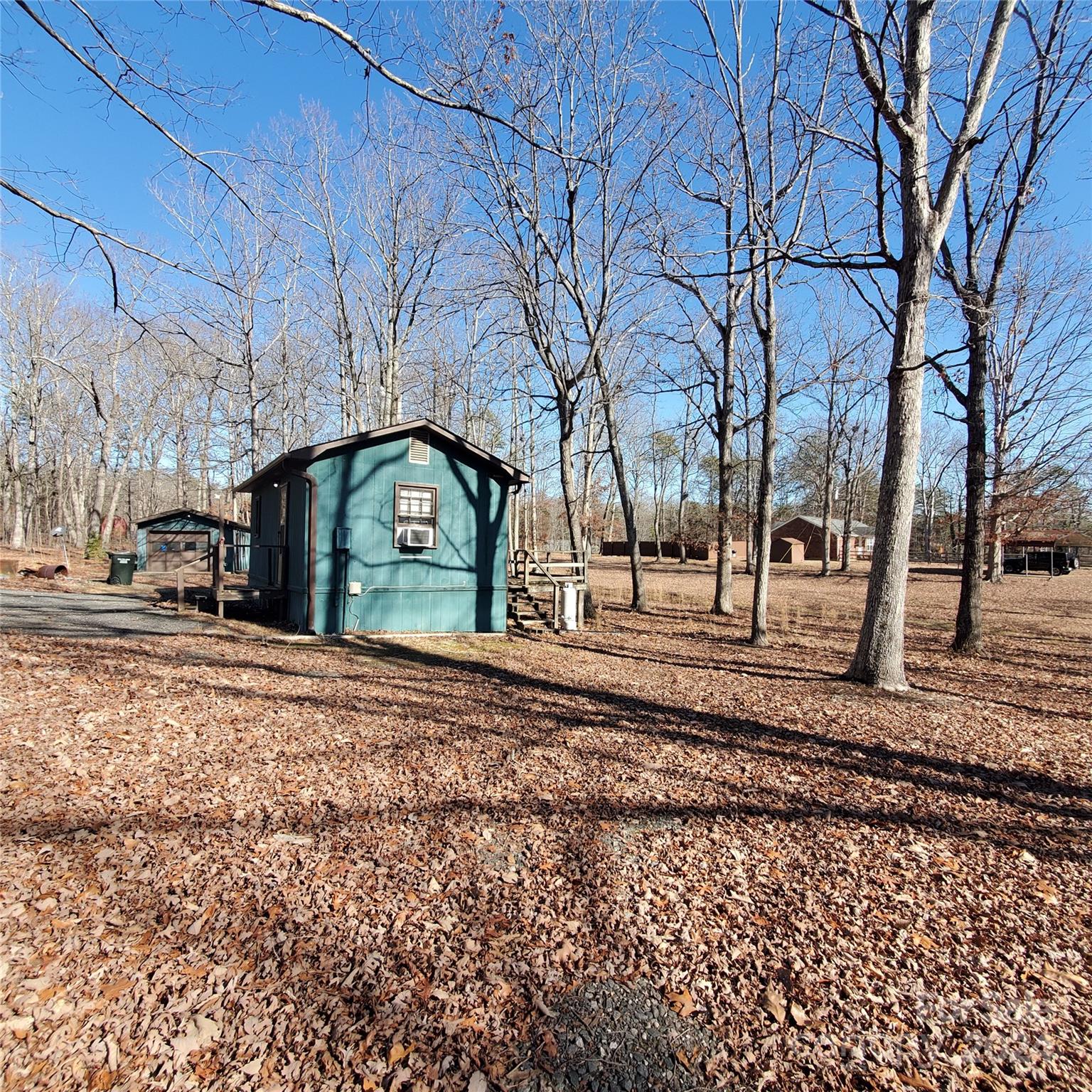 135 Printhad Road Dallas, NC 28034 - Photo 1 of 17 a view of road with large trees