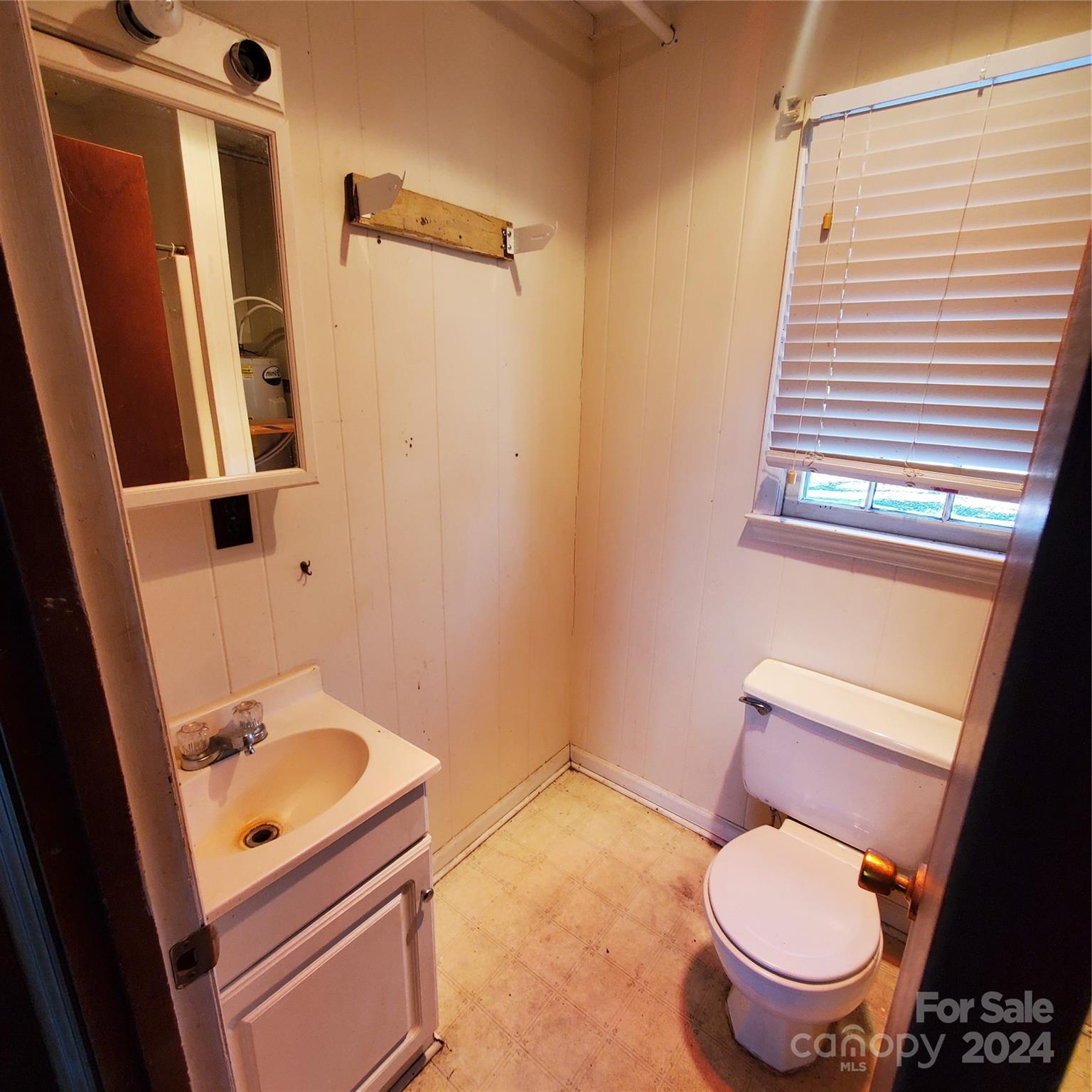 135 Printhad Road Dallas, NC 28034 - Photo 15 of 17 a white toilet sitting next to a bathroom sink