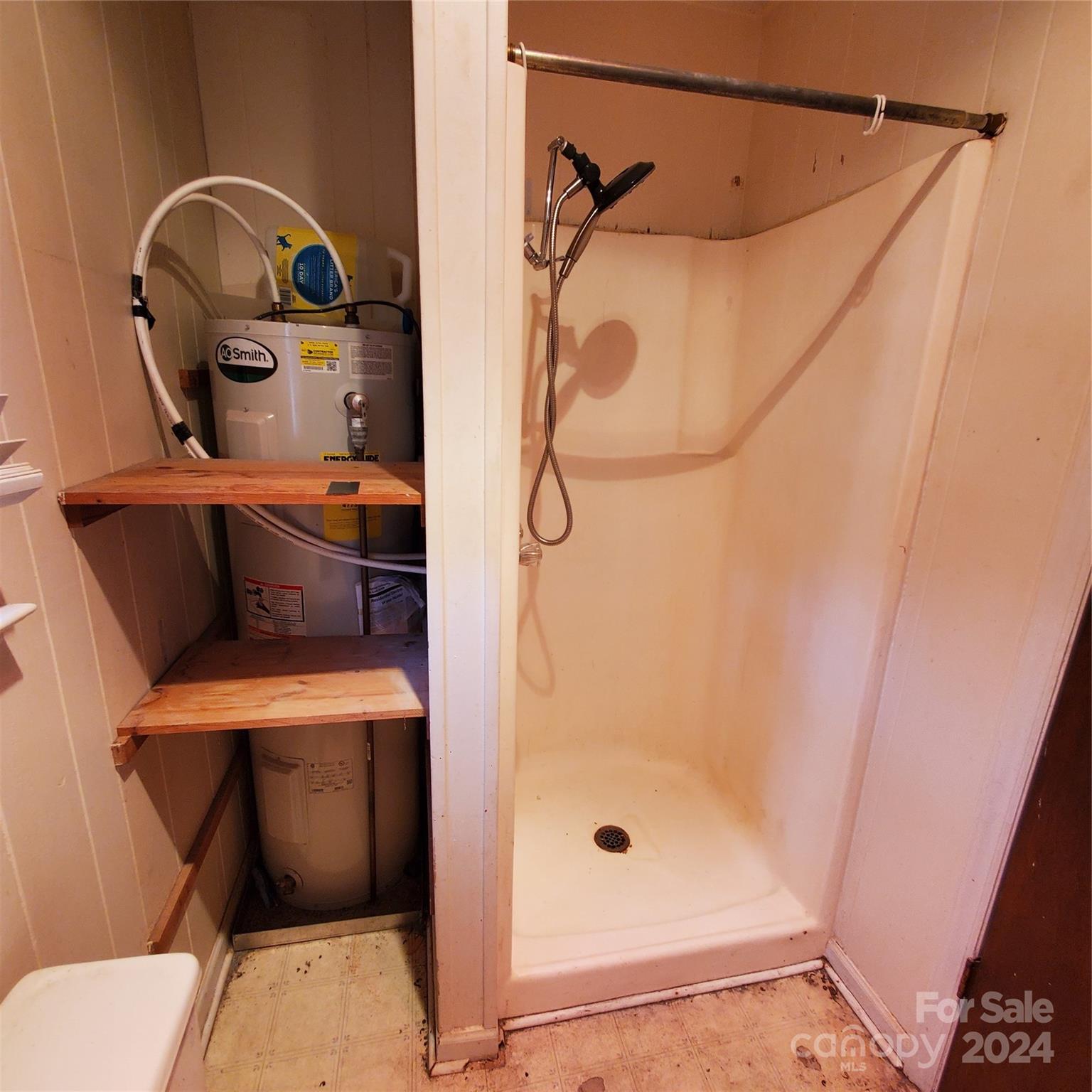 135 Printhad Road Dallas, NC 28034 - Photo 16 of 17 a bathroom with a toilet and a shower