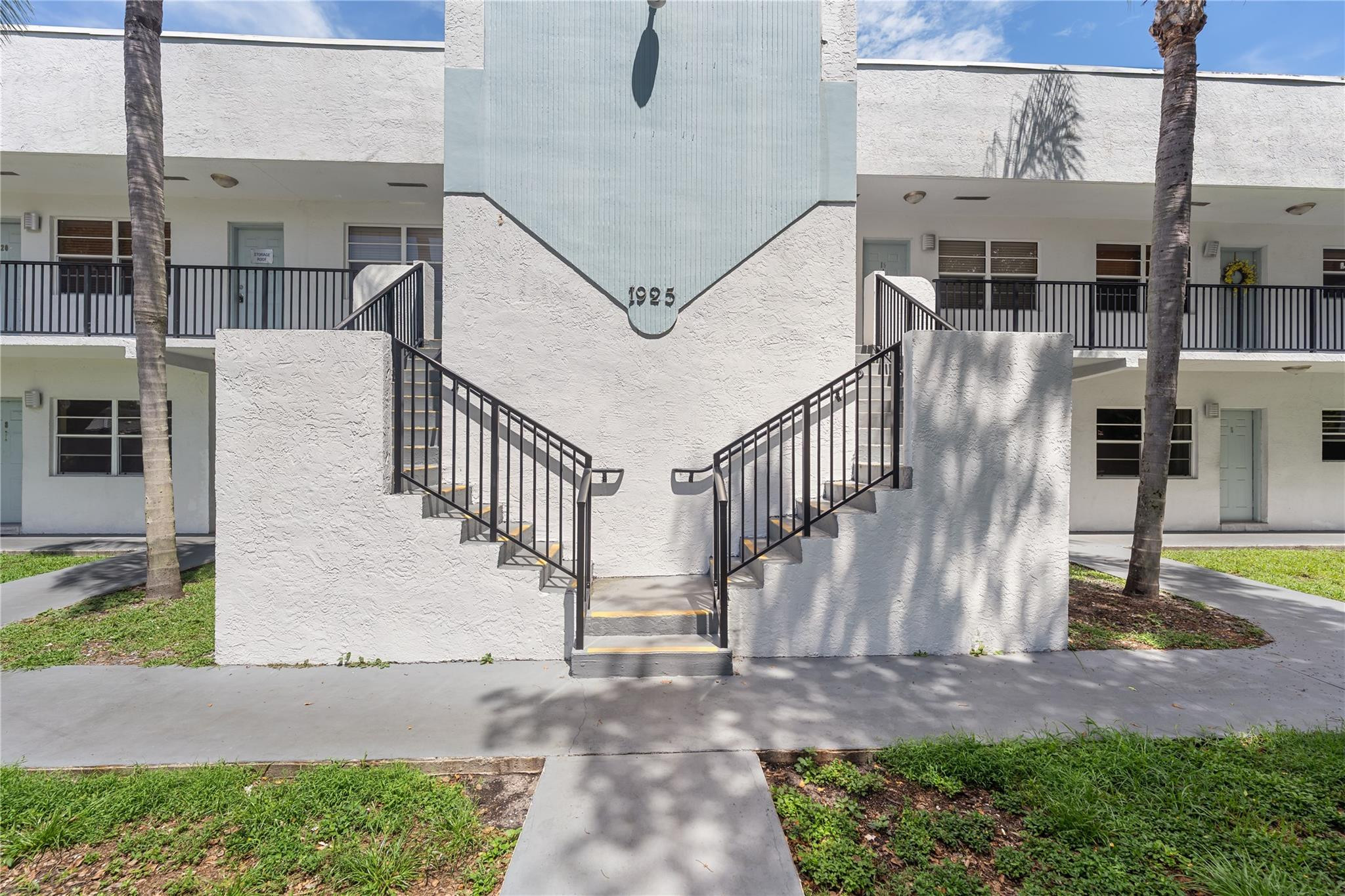 1925 Madison Street, Unit 14 Hollywood, FL 33020 - Photo 1 of 10 a view of a patio with table and chairs