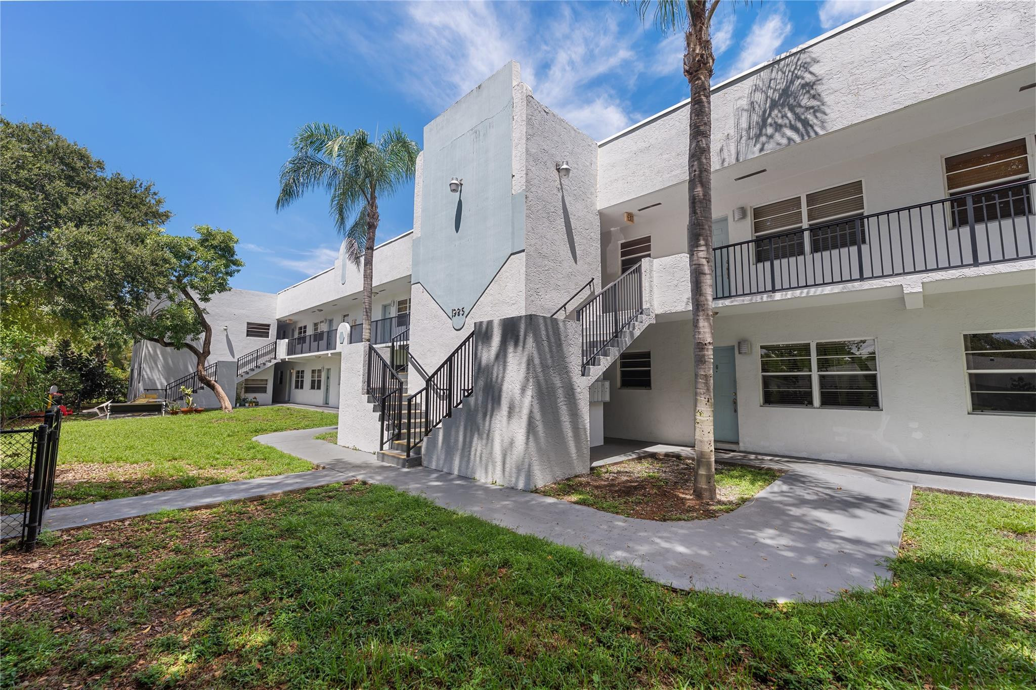 1925 Madison Street, Unit 14 Hollywood, FL 33020 - Photo 2 of 10 a view of a house with a yard