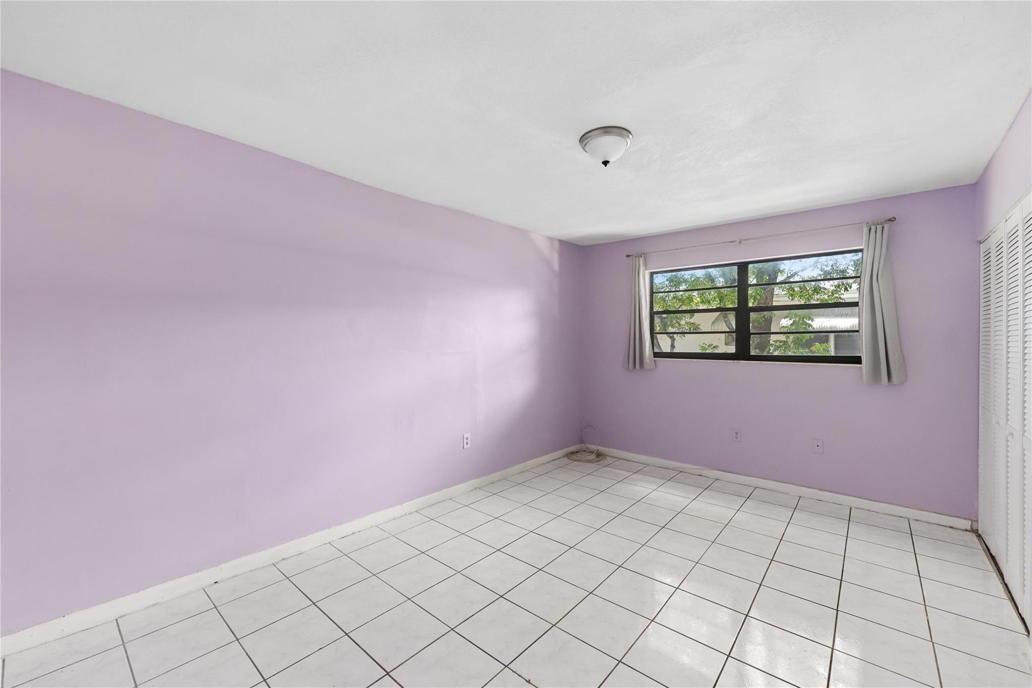 1925 Madison Street, Unit 14 Hollywood, FL 33020 - Photo 6 of 10 a view of an empty room and window