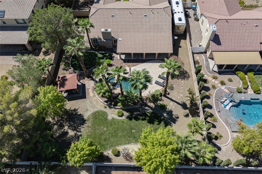 4670 Los Rancheros Avenue Las Vegas, NV 89129 - Photo 37 of 57 An aerial view highlights the tiled roofline and the private backyard pool oasis.