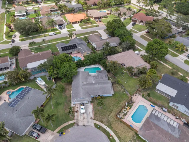 an aerial view of residential houses with outdoor space