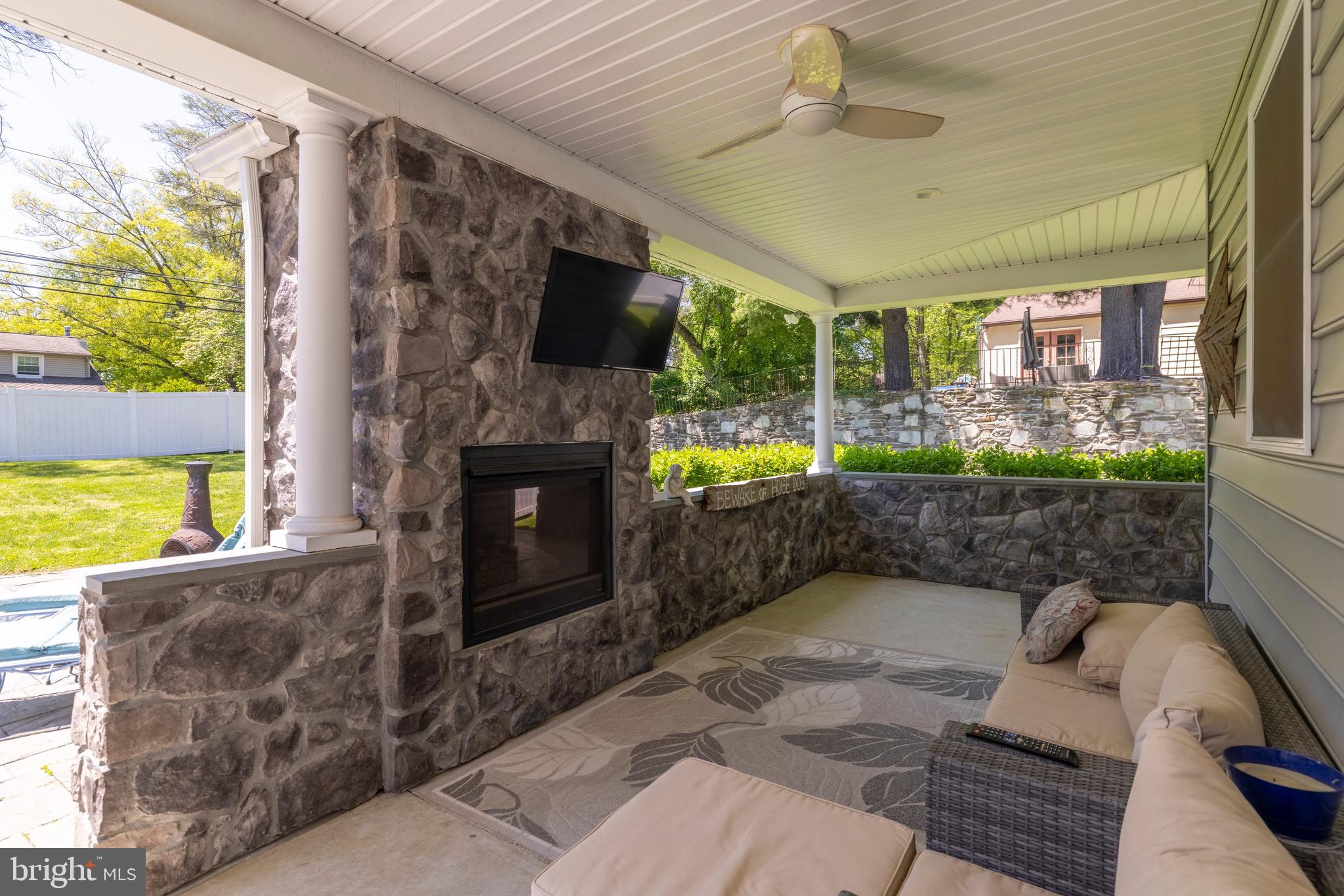 1086 Kingsley Road Rydal, PA 19046 - Photo 41 of 58 Rear Covered Patio with TV & Gas Fireplace
