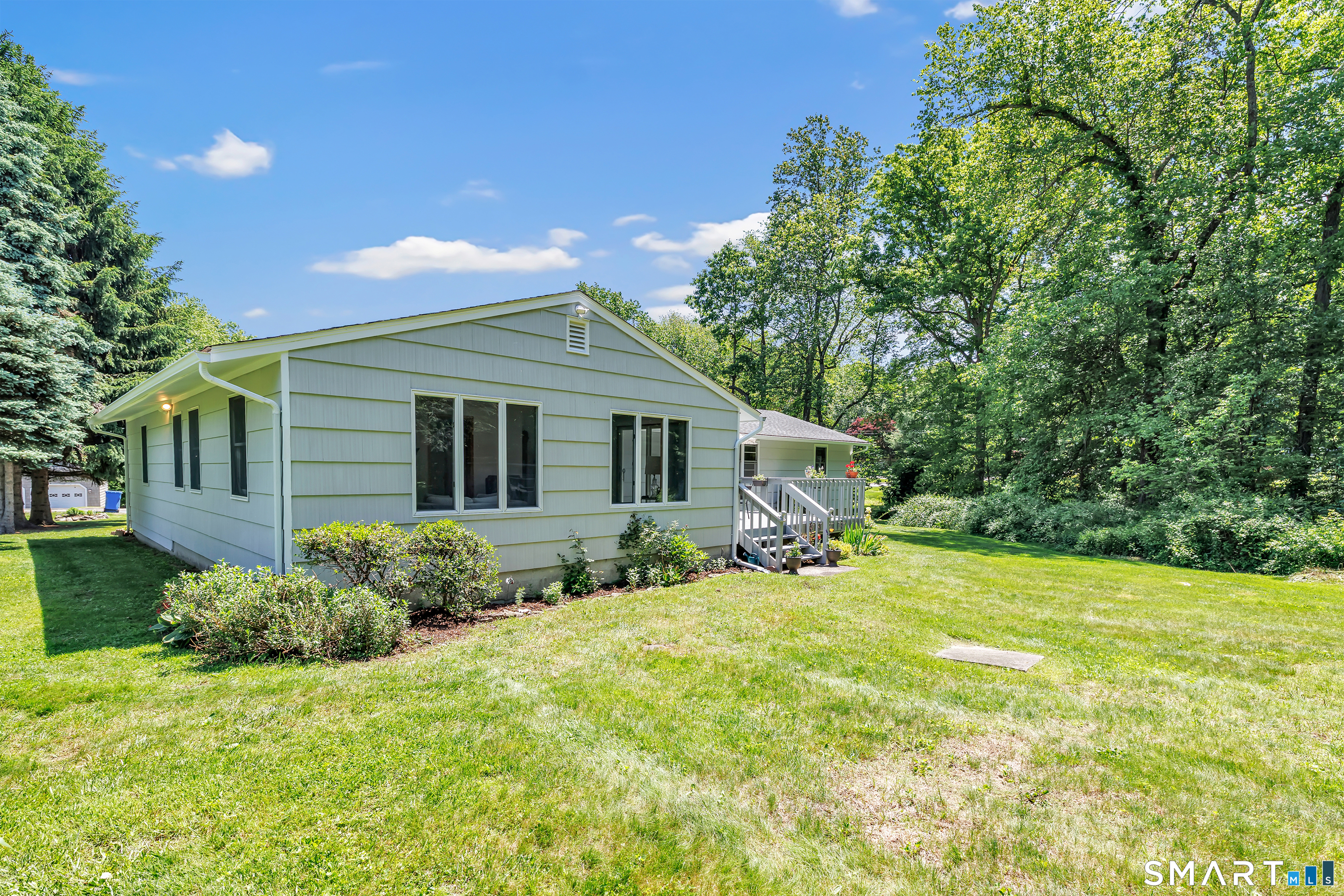 223 Wheeler Road Monroe, CT 06468 - Photo 31 of 35 a view of a house with backyard and sitting area