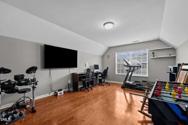 a room with furniture and a flat screen tv