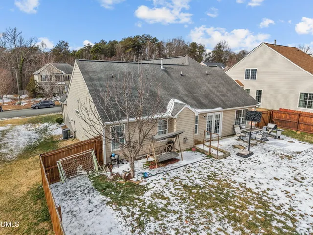 a view of a house with a wooden deck
