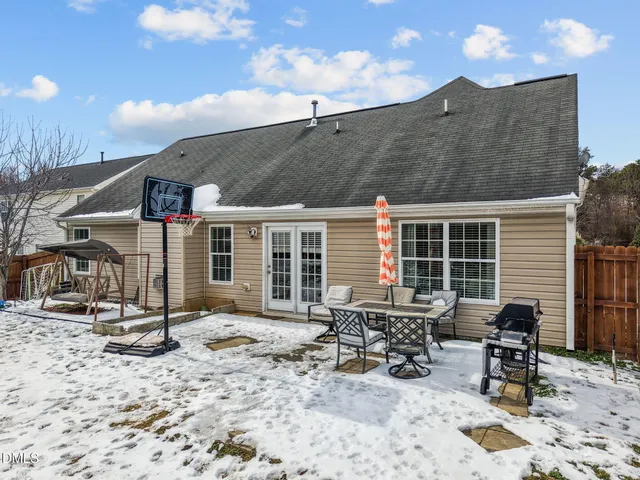 a view of a backyard with sitting area and furniture