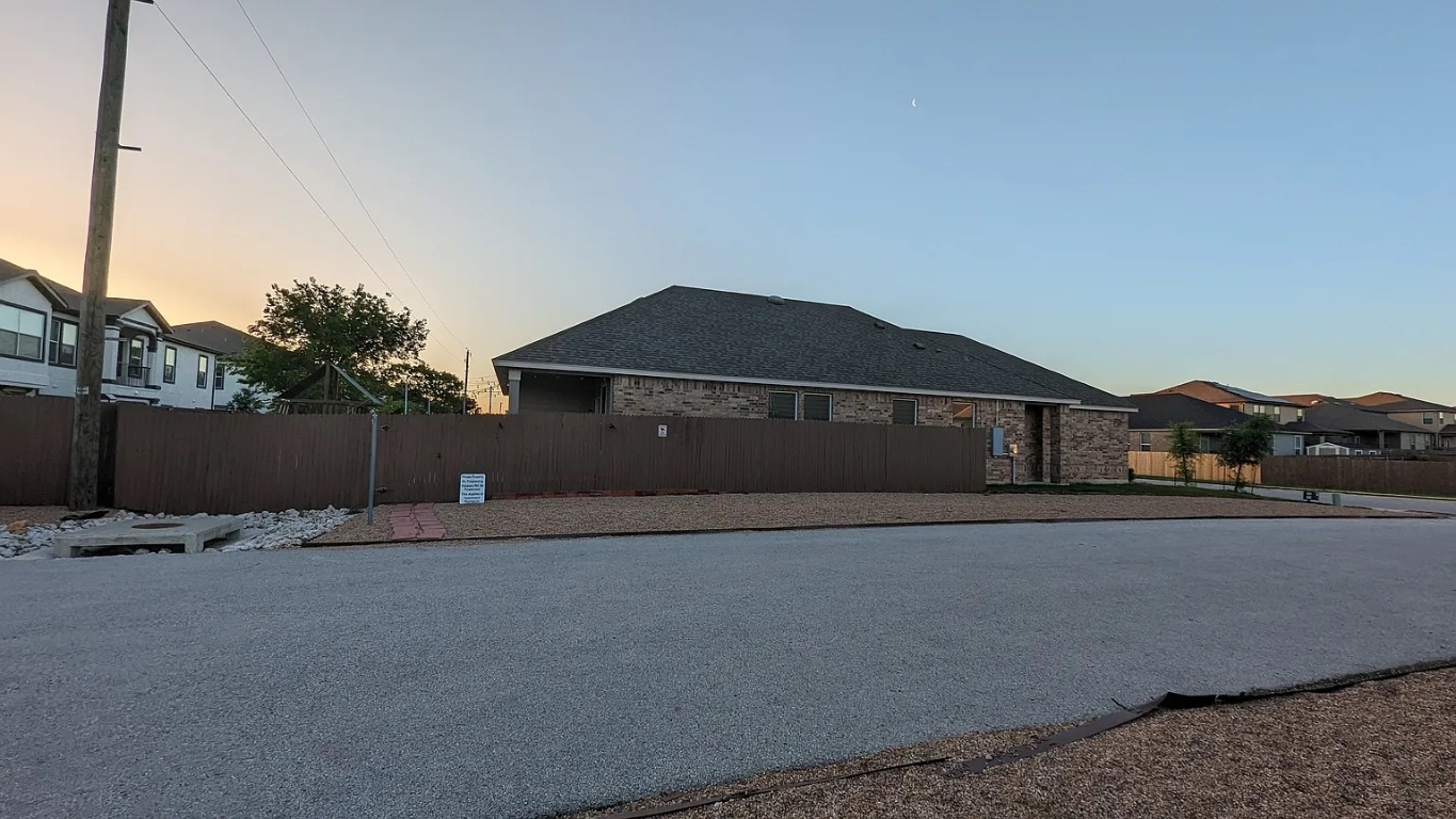 612 Ayinger Lane Austin, TX 78728 - Photo 2 of 13 a front view of a house with a yard and garage