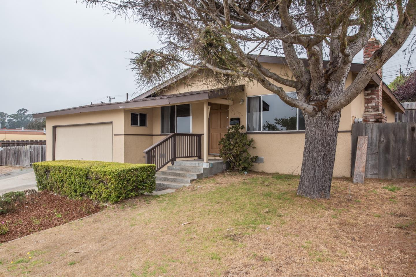 1816 Juarez Street Seaside, CA 93955 - Photo 1 of 27 a front view of a house with a yard and garage