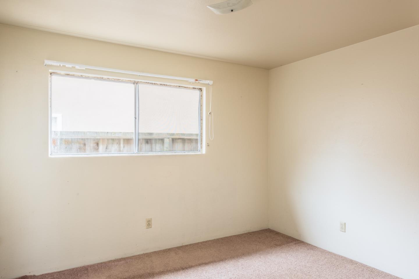 1816 Juarez Street Seaside, CA 93955 - Photo 13 of 27 an empty room with a window