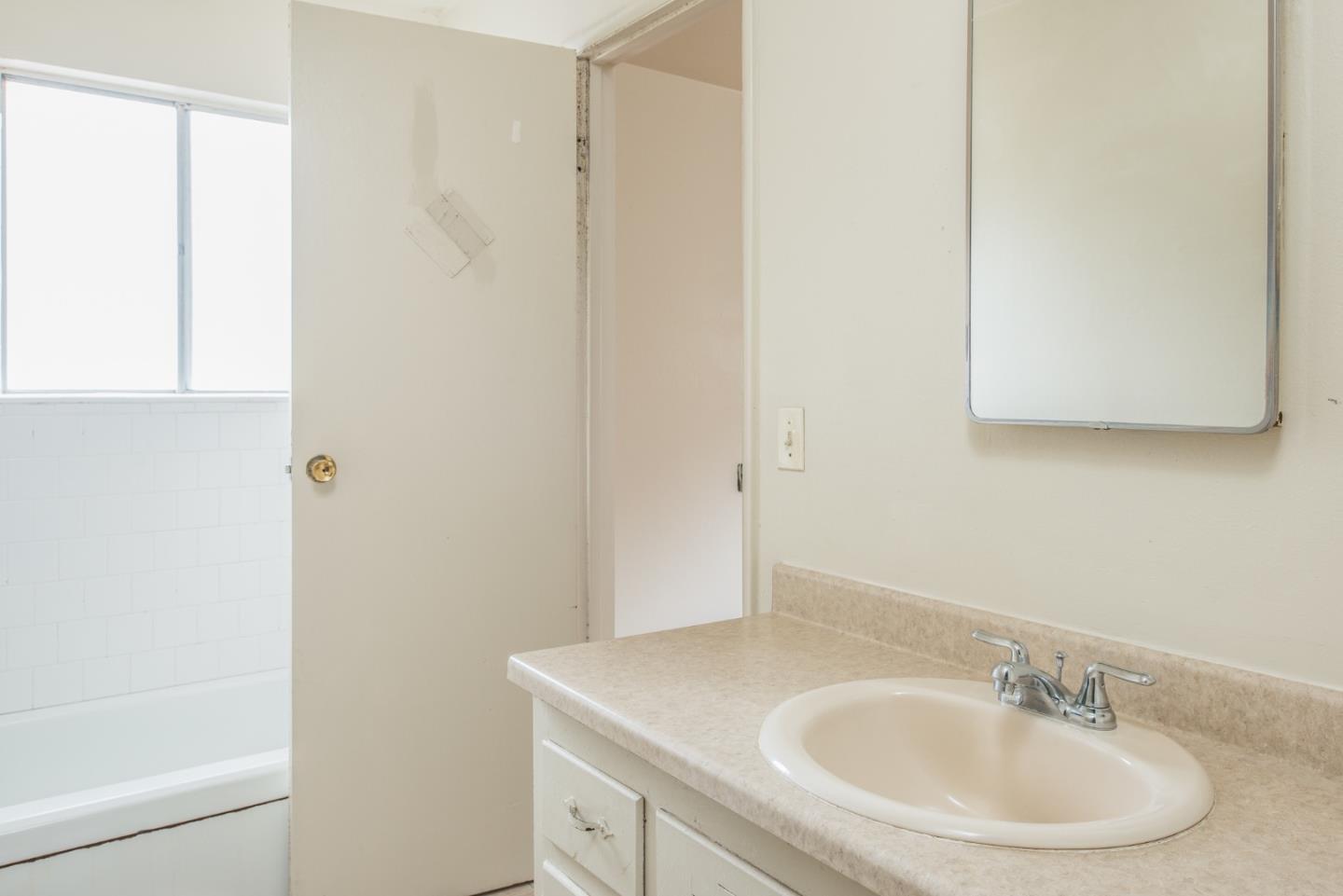 1816 Juarez Street Seaside, CA 93955 - Photo 15 of 27 a bathroom with a sink and a mirror