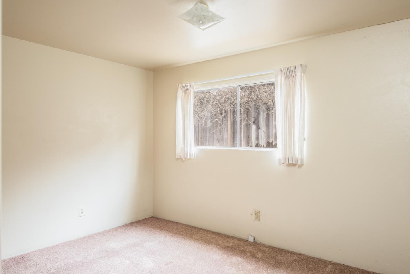 1816 Juarez Street Seaside, CA 93955 - Photo 17 of 27 an empty room with a window