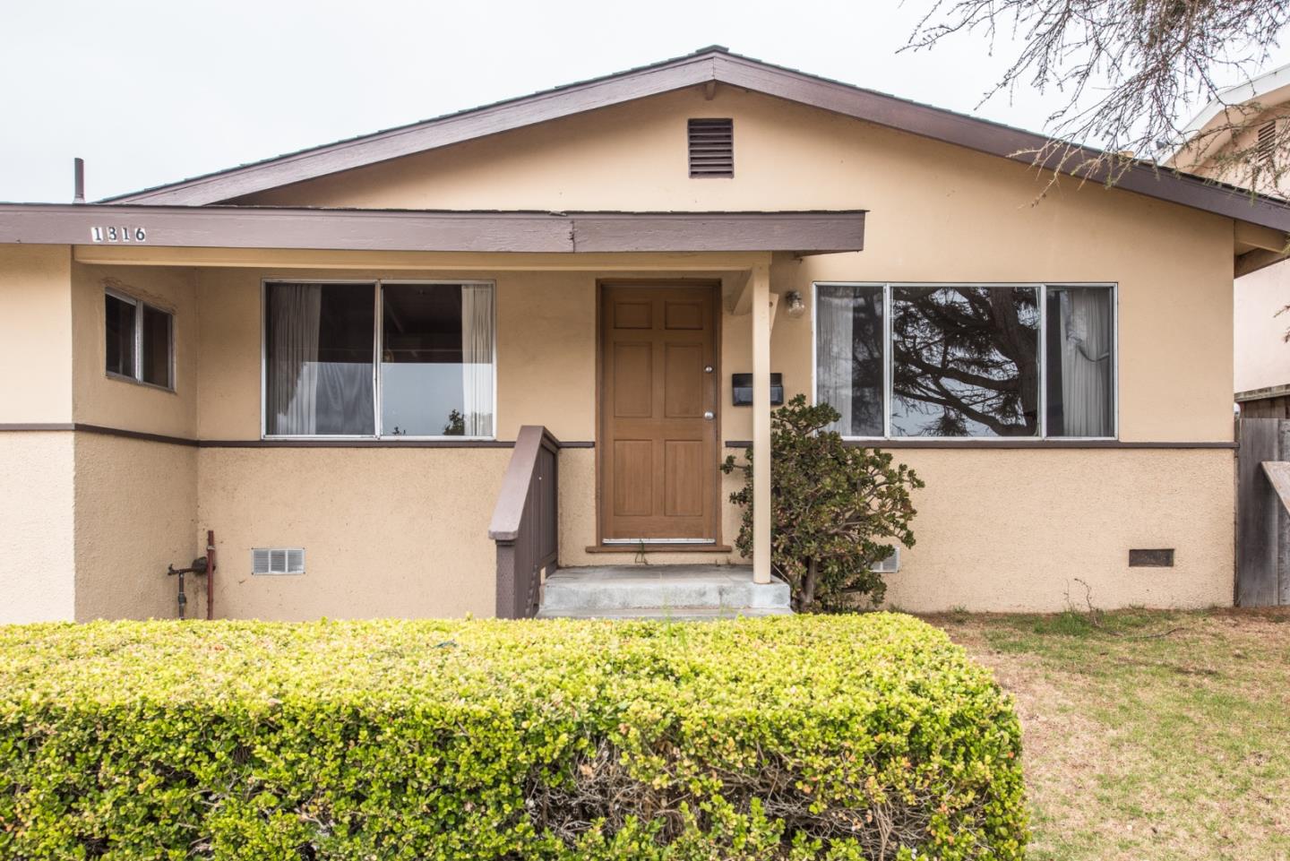 1816 Juarez Street Seaside, CA 93955 - Photo 2 of 27 a front view of a house with a yard