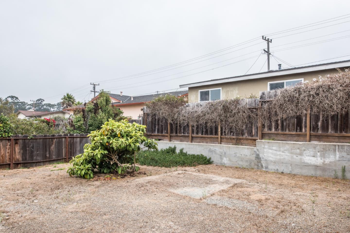 1816 Juarez Street Seaside, CA 93955 - Photo 21 of 27 a front view of a house with a yard and garage
