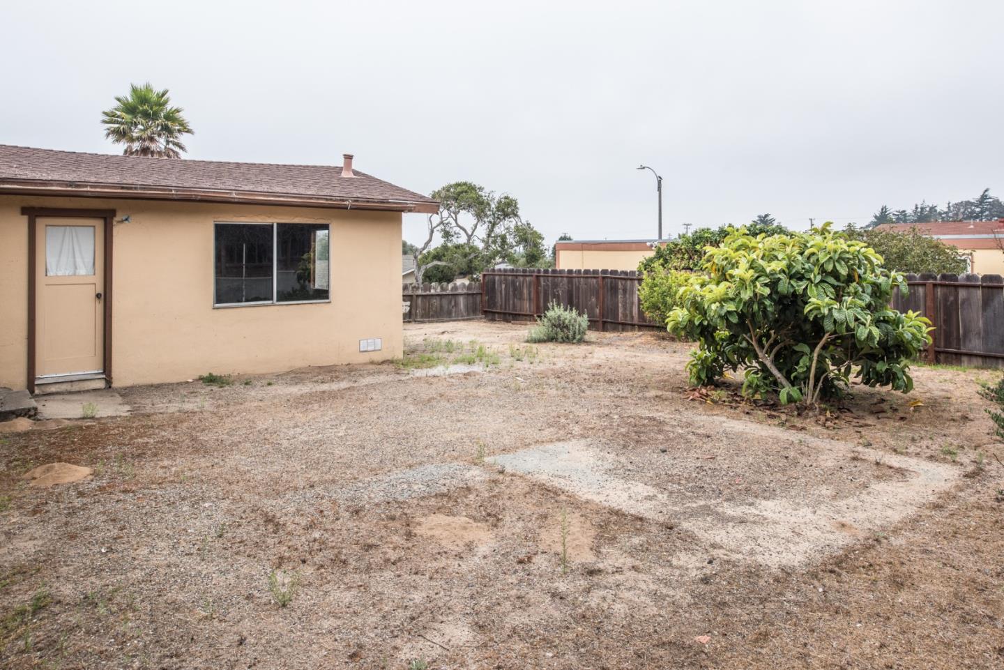 1816 Juarez Street Seaside, CA 93955 - Photo 24 of 27 a view of a house with a porch and garden