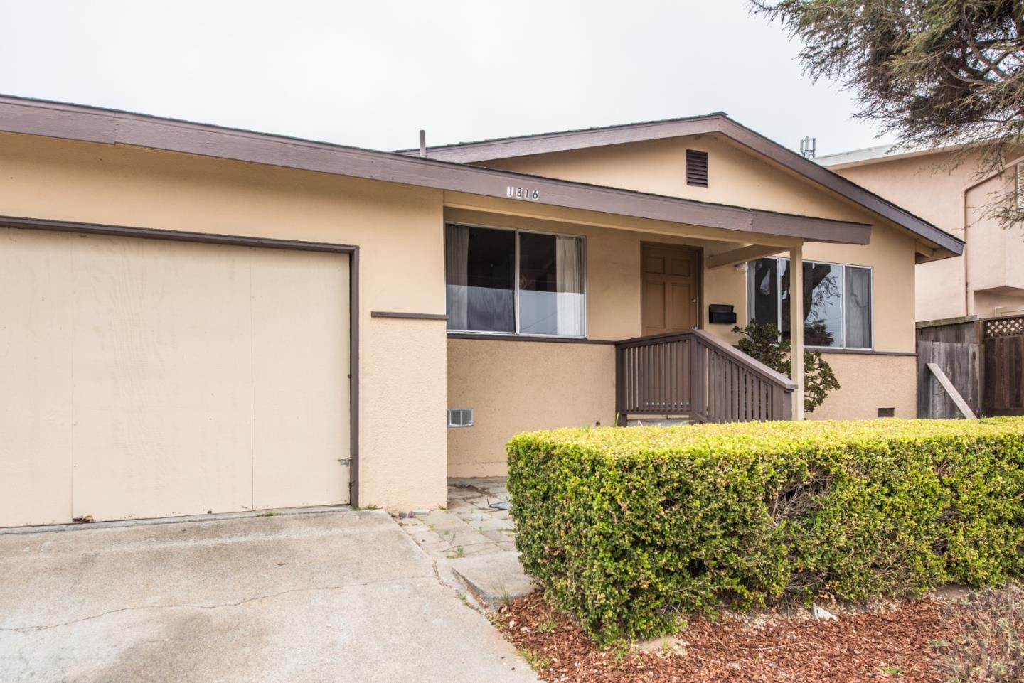 1816 Juarez Street Seaside, CA 93955 - Photo 3 of 27 a front view of a house with garden