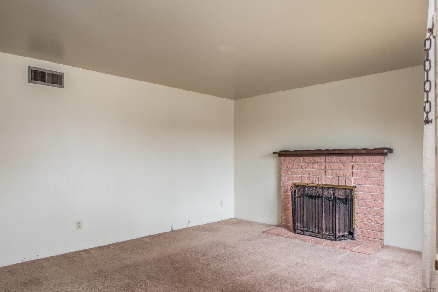 1816 Juarez Street Seaside, CA 93955 - Photo 5 of 27 an empty room with fireplace