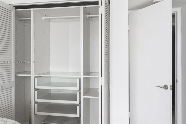 a close view of closet with wooden floor