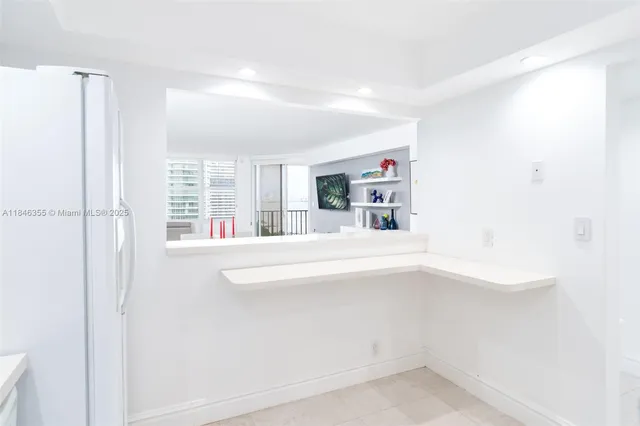 a en suite bathroom with a bathtub sink and mirror