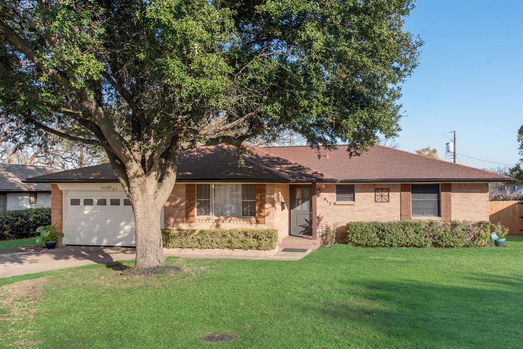 812 Oxbow Lane Dallas, TX 75241 - Photo 1 of 1 a front view of house with yard and green space