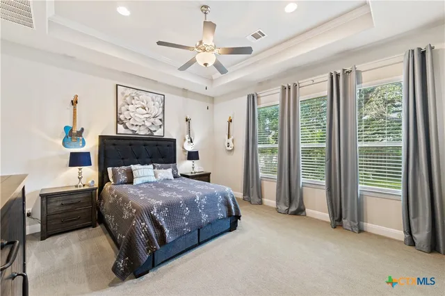 a spacious bathroom with a tub sink shower and a mirror
