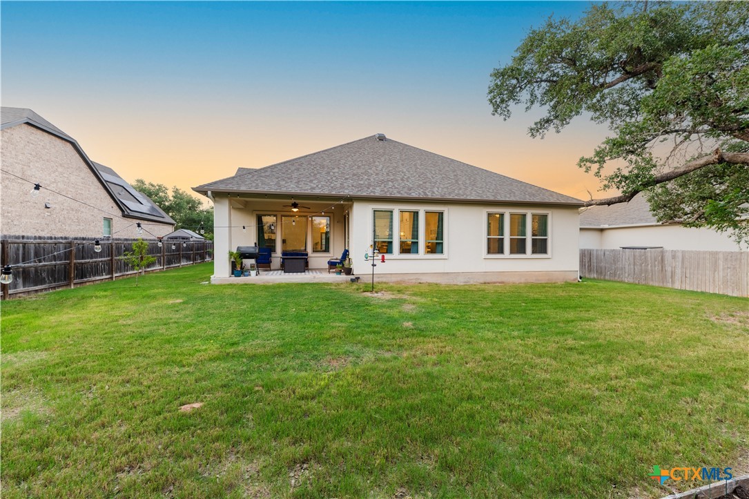 264 Axis Loop Georgetown, TX 78628 - Photo 29 of 33 a view of a house with a backyard