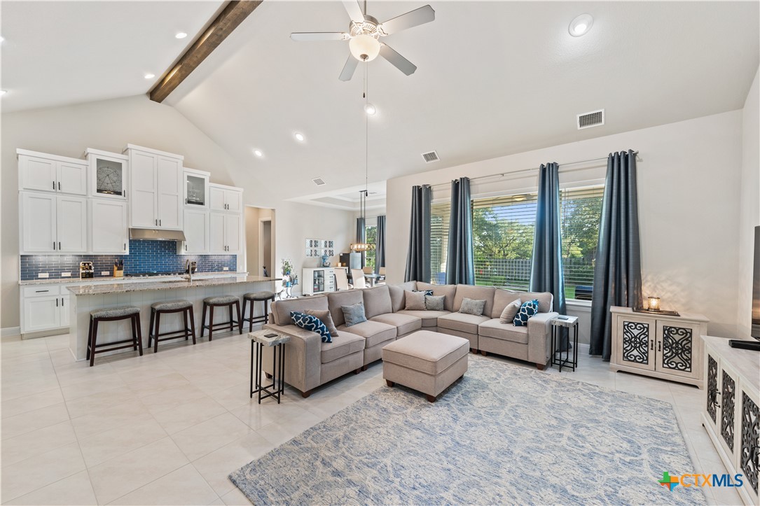 264 Axis Loop Georgetown, TX 78628 - Photo 7 of 33 a living room with furniture and large windows