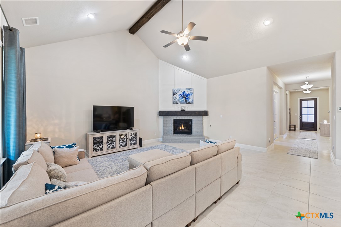 264 Axis Loop Georgetown, TX 78628 - Photo 9 of 33 a living room with furniture and a flat screen tv