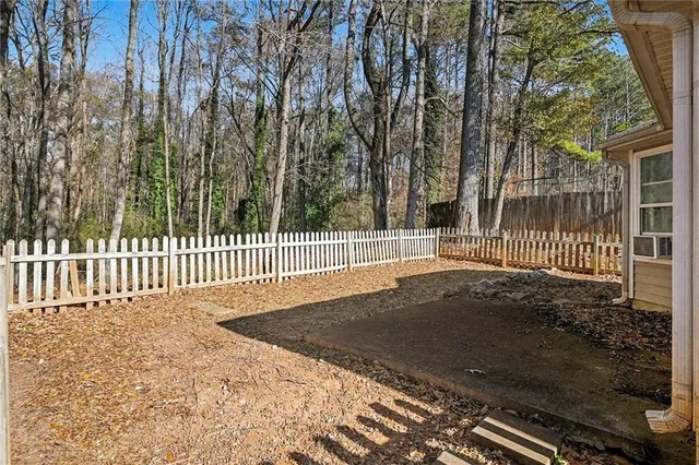a view of a park with a fence