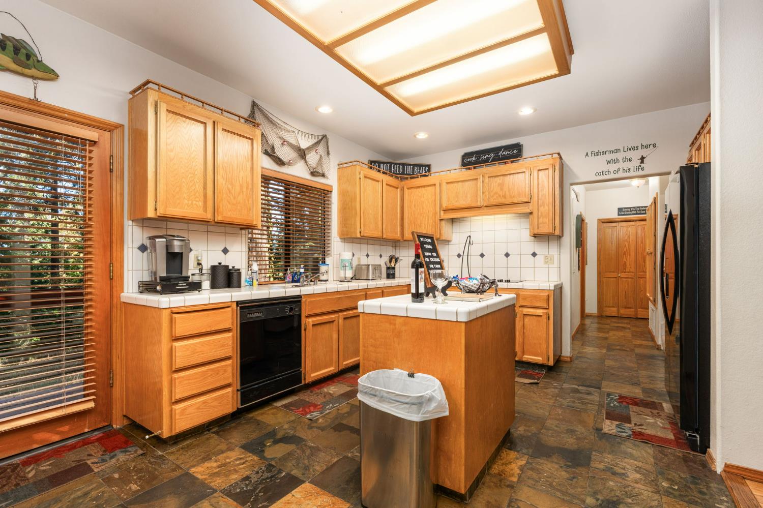 41811 Gray Rock Road Shaver Lake, CA 93664 - Photo 16 of 33 a kitchen with a refrigerator a sink dishwasher stove and oven