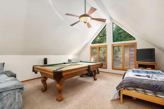 a bedroom with furniture and a window