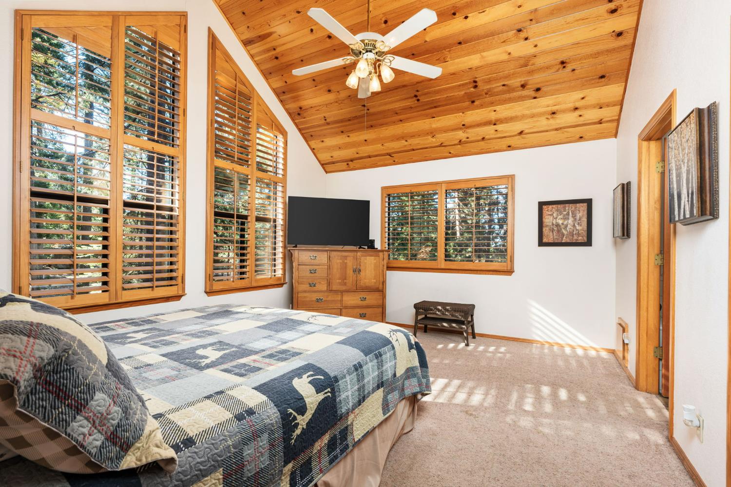 41811 Gray Rock Road Shaver Lake, CA 93664 - Photo 26 of 33 a bedroom with a bed and wooden floor