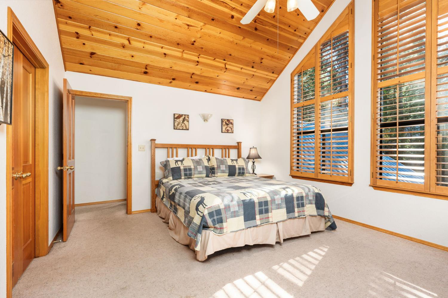 41811 Gray Rock Road Shaver Lake, CA 93664 - Photo 27 of 33 a bed sitting in a bedroom next to a window