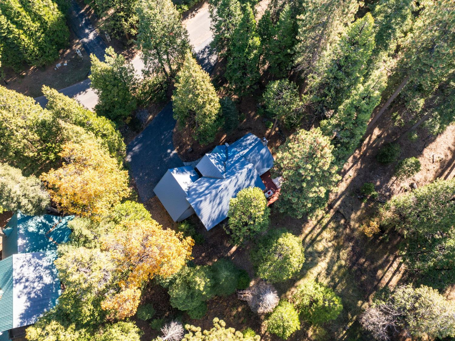 41811 Gray Rock Road Shaver Lake, CA 93664 - Photo 32 of 33 a aerial view of a house with a yard and garden