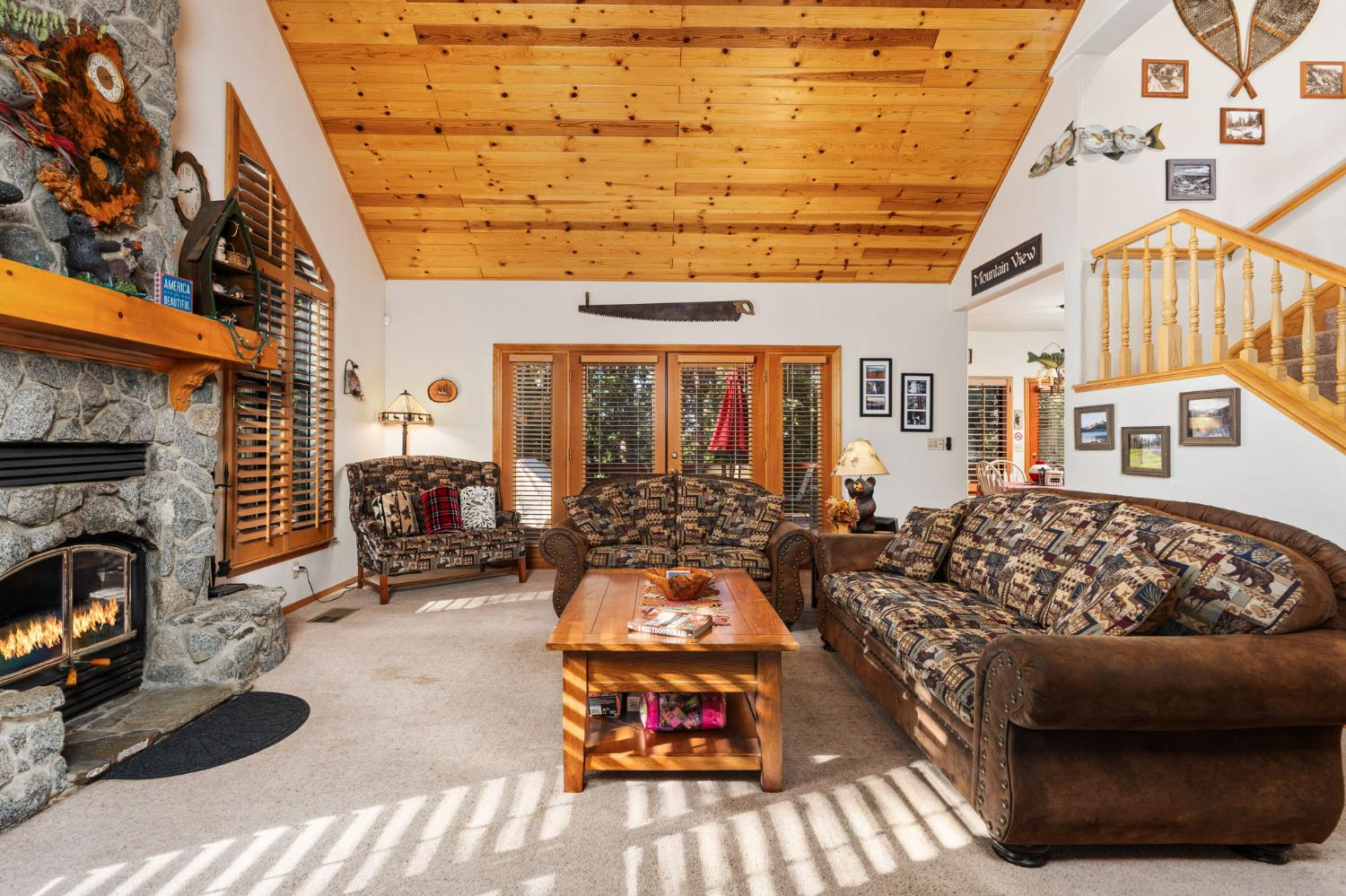 41811 Gray Rock Road Shaver Lake, CA 93664 - Photo 9 of 33 a living room with furniture a fireplace and a flat screen tv