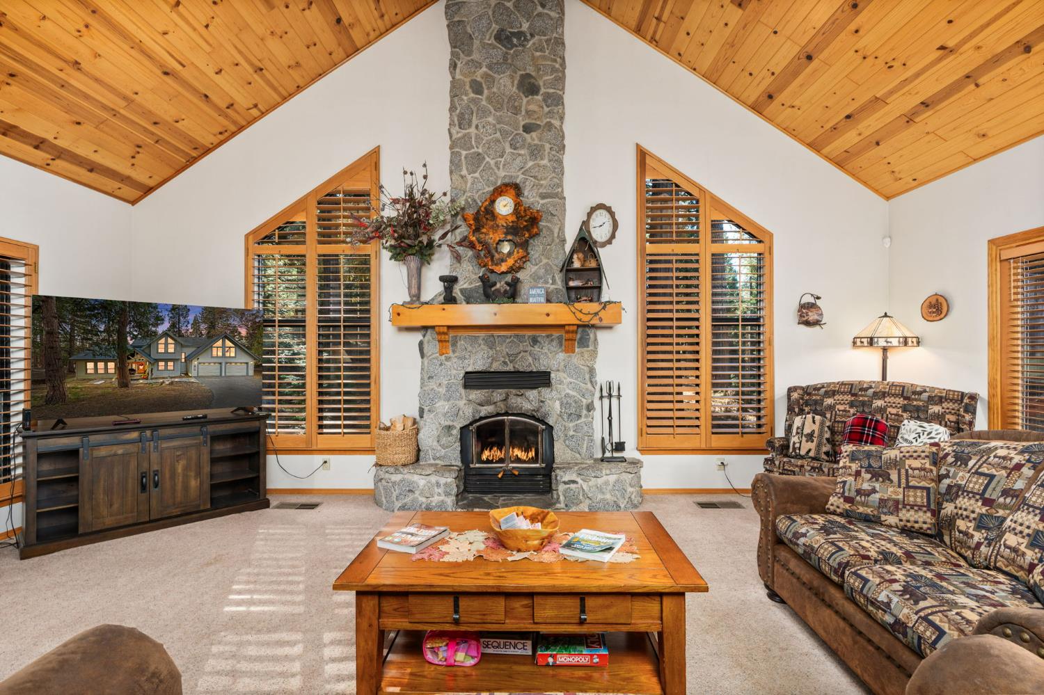 41811 Gray Rock Road Shaver Lake, CA 93664 - Photo 10 of 33 a living room with furniture a flat screen tv and a fireplace