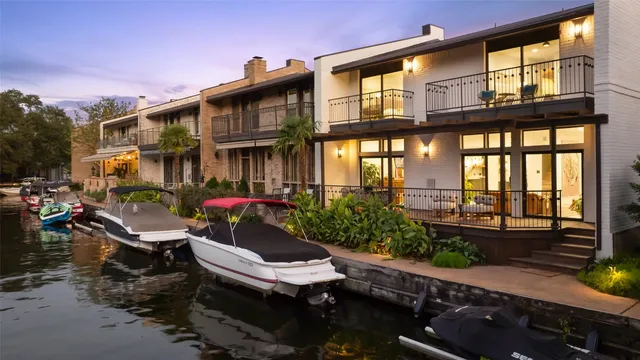a view of a patio with table and chairs and potted plants
