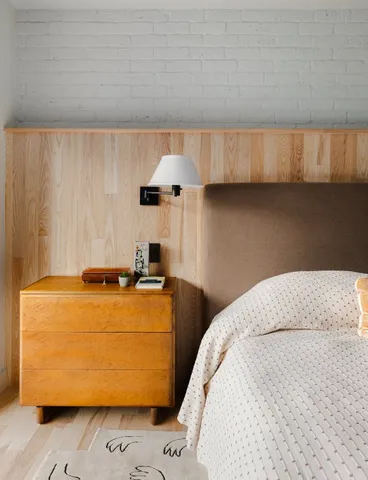 a bedroom with a bed and a dresser