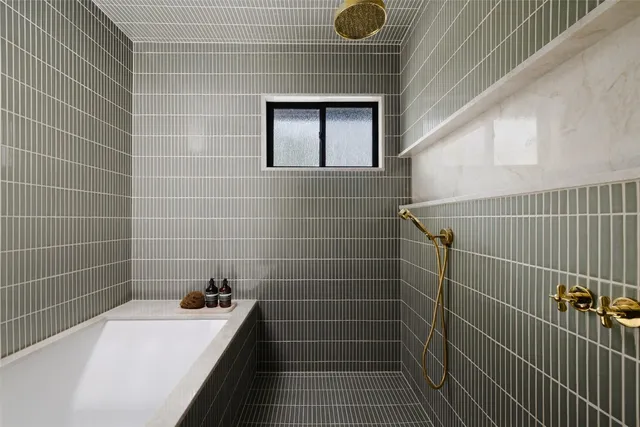 a bathroom with a sink and a shower